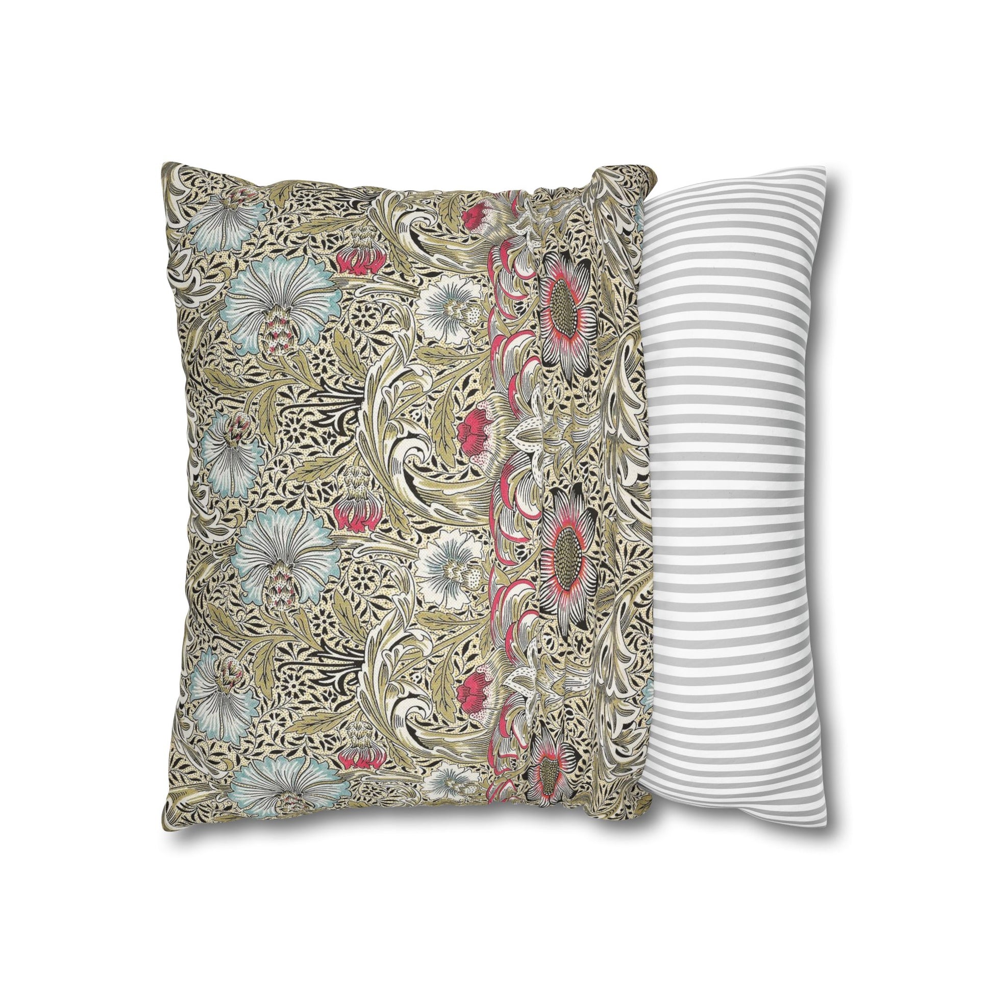 Decorative pillow with floral pattern next to a striped pillow on a white background