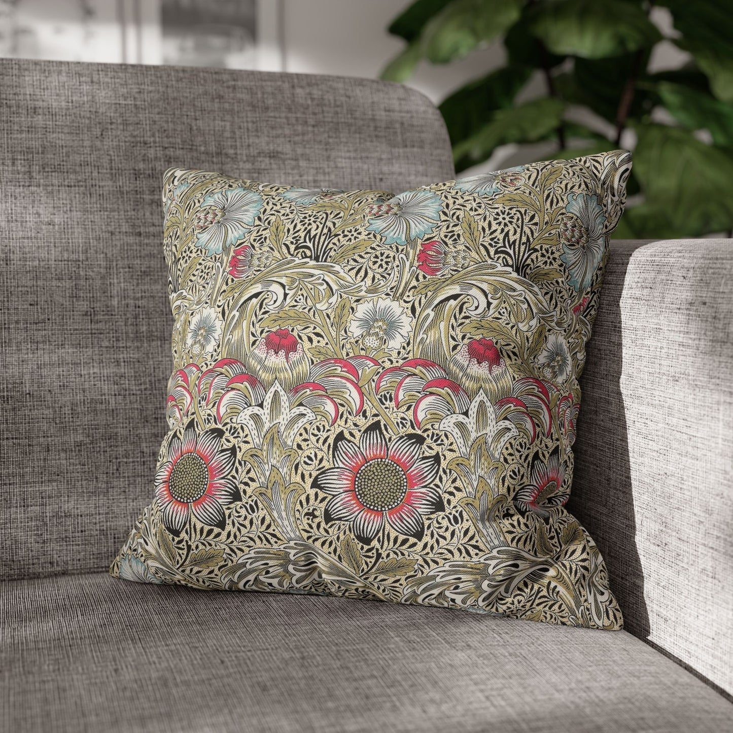 Decorative pillow with floral pattern on a gray sofa