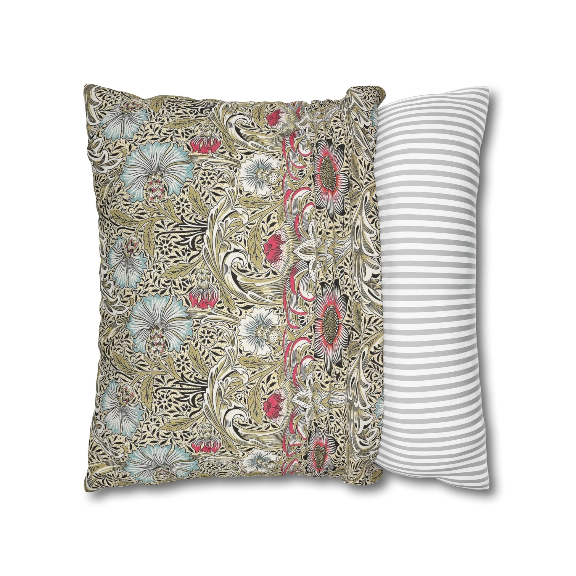 Decorative pillow with floral pattern next to a striped pillow on a white background