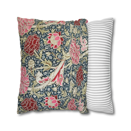 Two pillows, one with floral pattern and one with stripes, on a white background