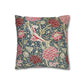 Decorative pillow with floral and bird pattern on a white background