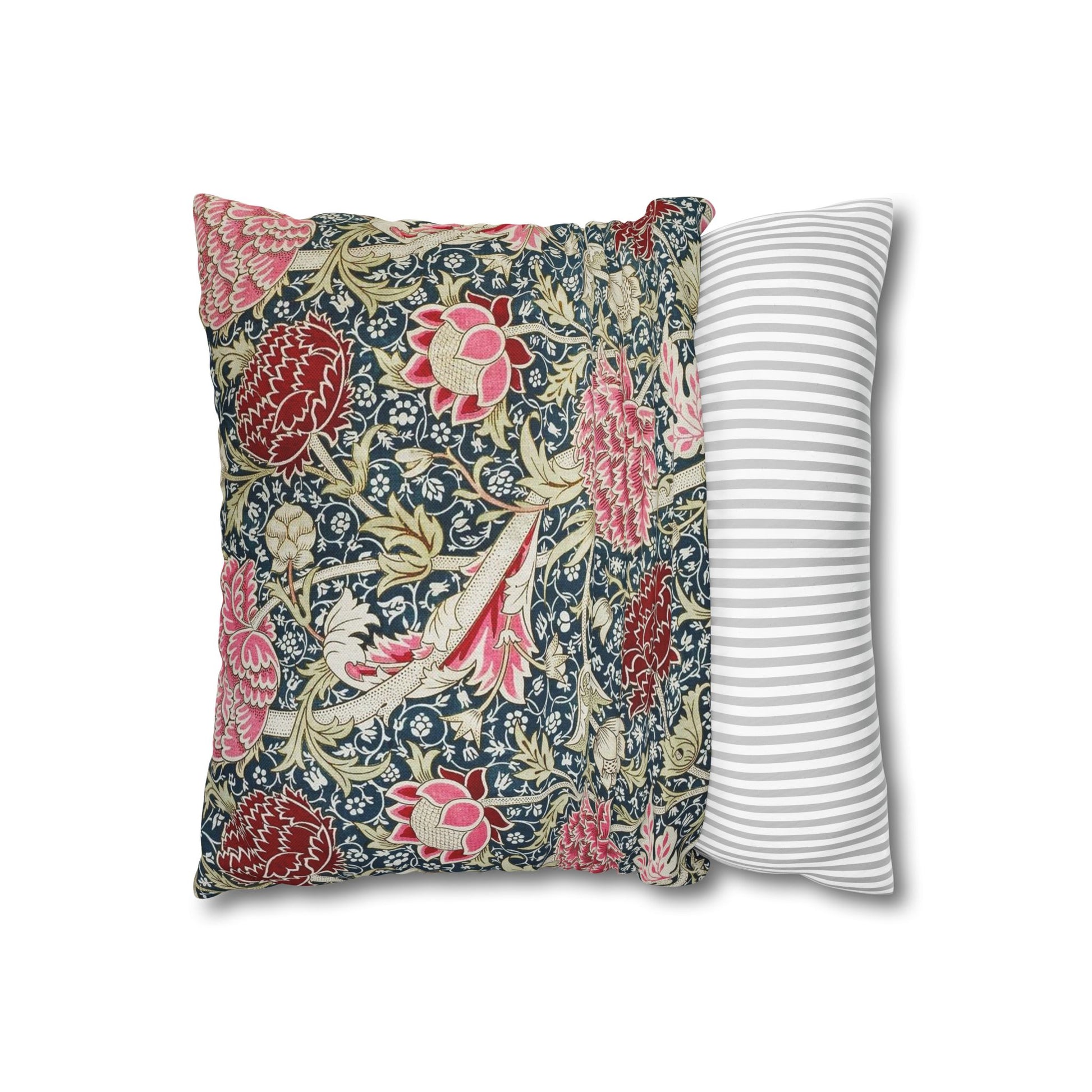 Two pillows, one with floral pattern and one with stripes, on a white background