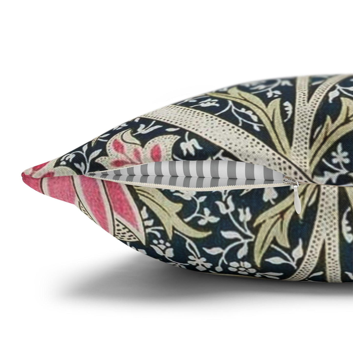 Decorative pillow with floral and striped pattern on a white background