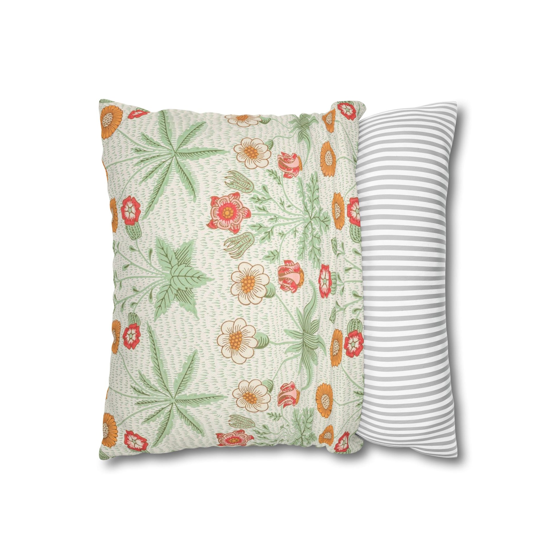 Two pillows, one with floral pattern and the other with stripes, on a white background.