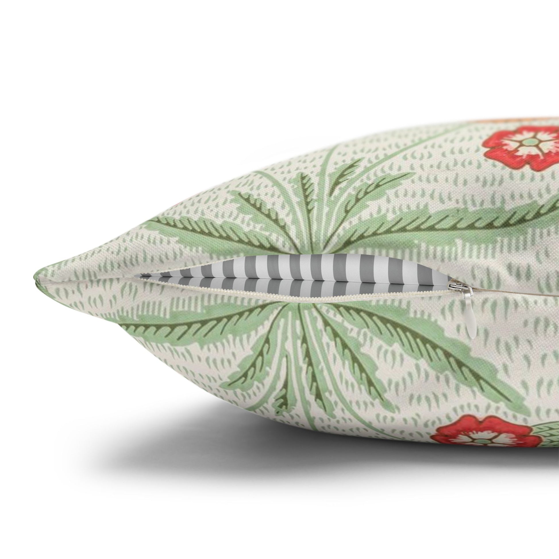 Decorative pillow with floral pattern on a white background