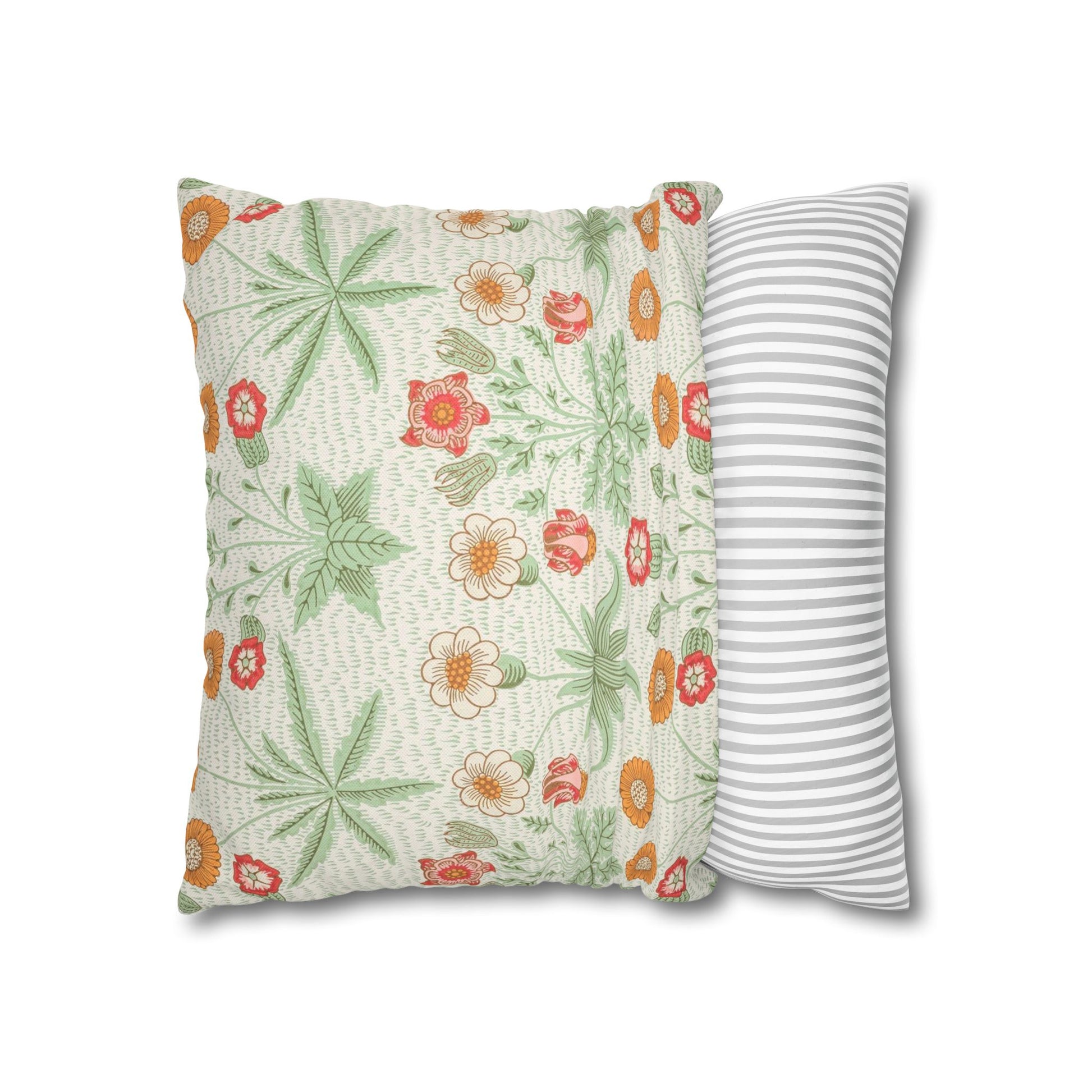 Two pillows, one with floral pattern and the other with stripes, on a white background.