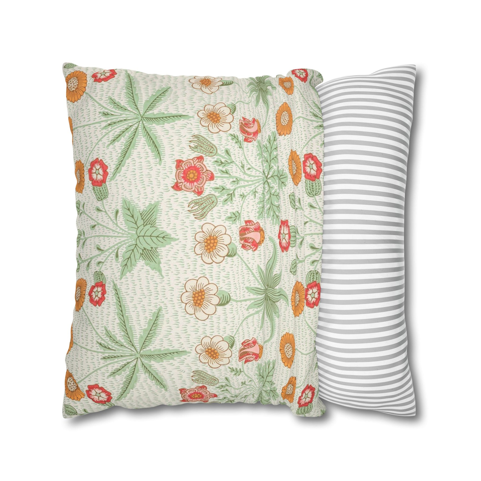 Floral-patterned pillow and a striped pillow on a white background