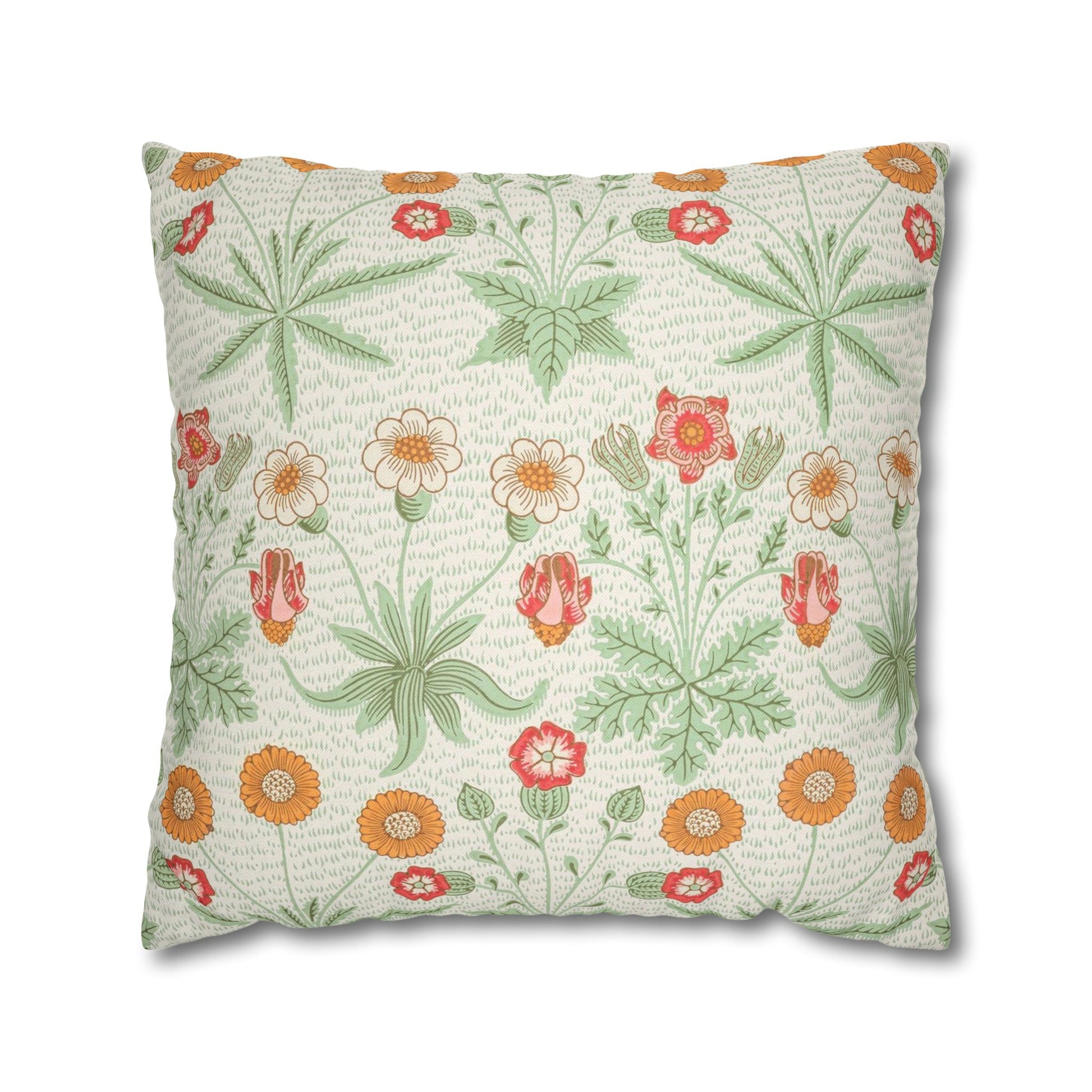 Floral patterned pillow with green leaves and colorful flowers on a white background