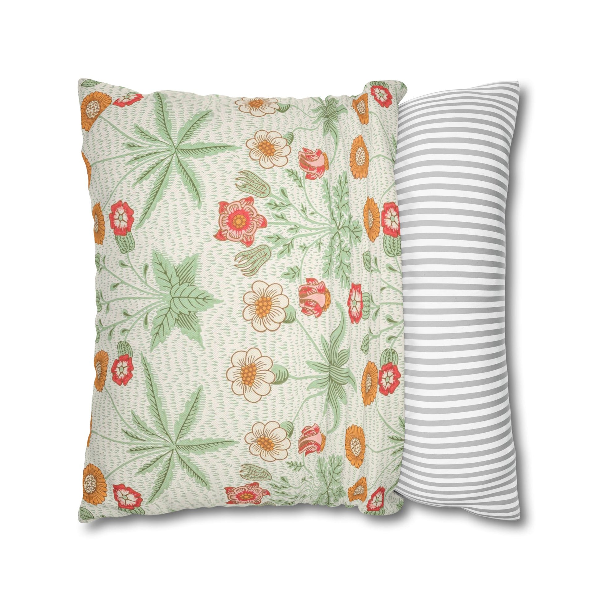 Floral-patterned pillow and a striped pillow on a white background