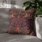 Decorative pillow with intricate pattern on a gray sofa