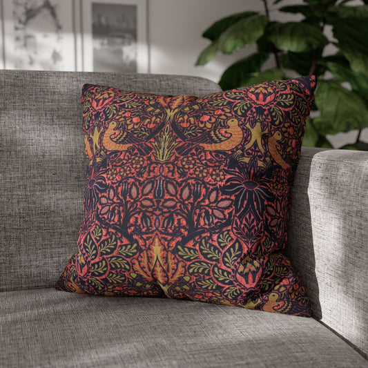 Decorative pillow with intricate pattern on a gray sofa