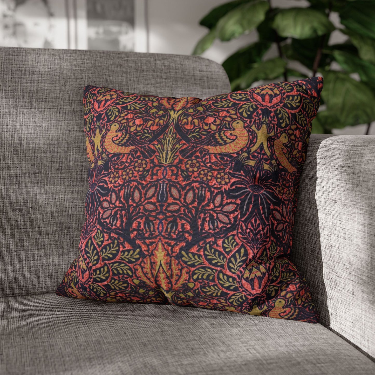 Decorative pillow with a colorful pattern on a gray sofa