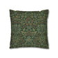 Decorative pillow with intricate green and brown pattern on a white background