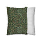 Two pillows, one with a green floral pattern and the other with a white and gray striped pattern, on a white background.