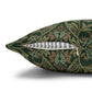 Decorative pillow with a green floral pattern on a white background