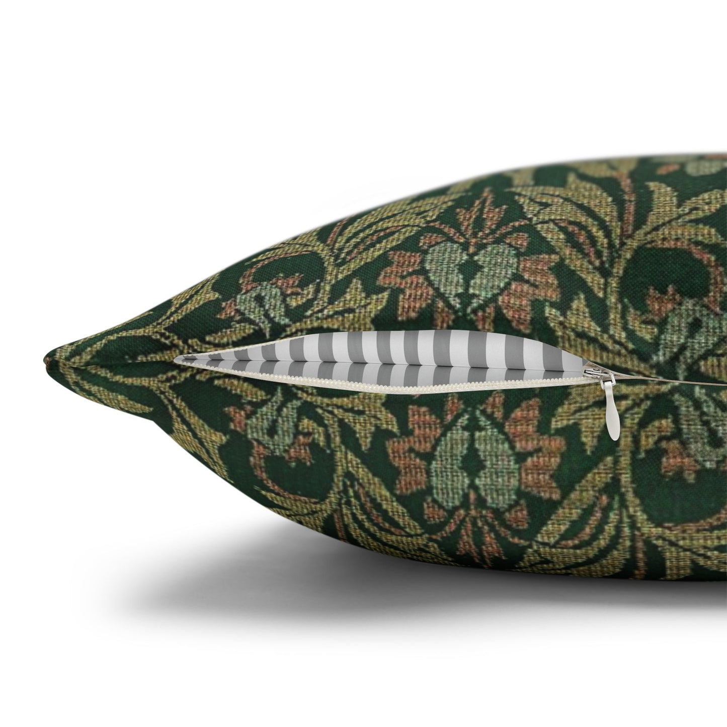 Decorative pillow with a green floral pattern on a white background