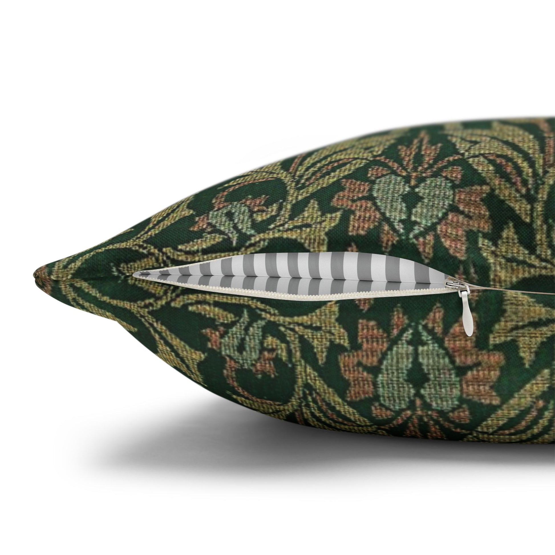 Decorative pillow with a green floral pattern on a white background