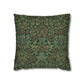 Decorative pillow with intricate green and brown pattern on a white background