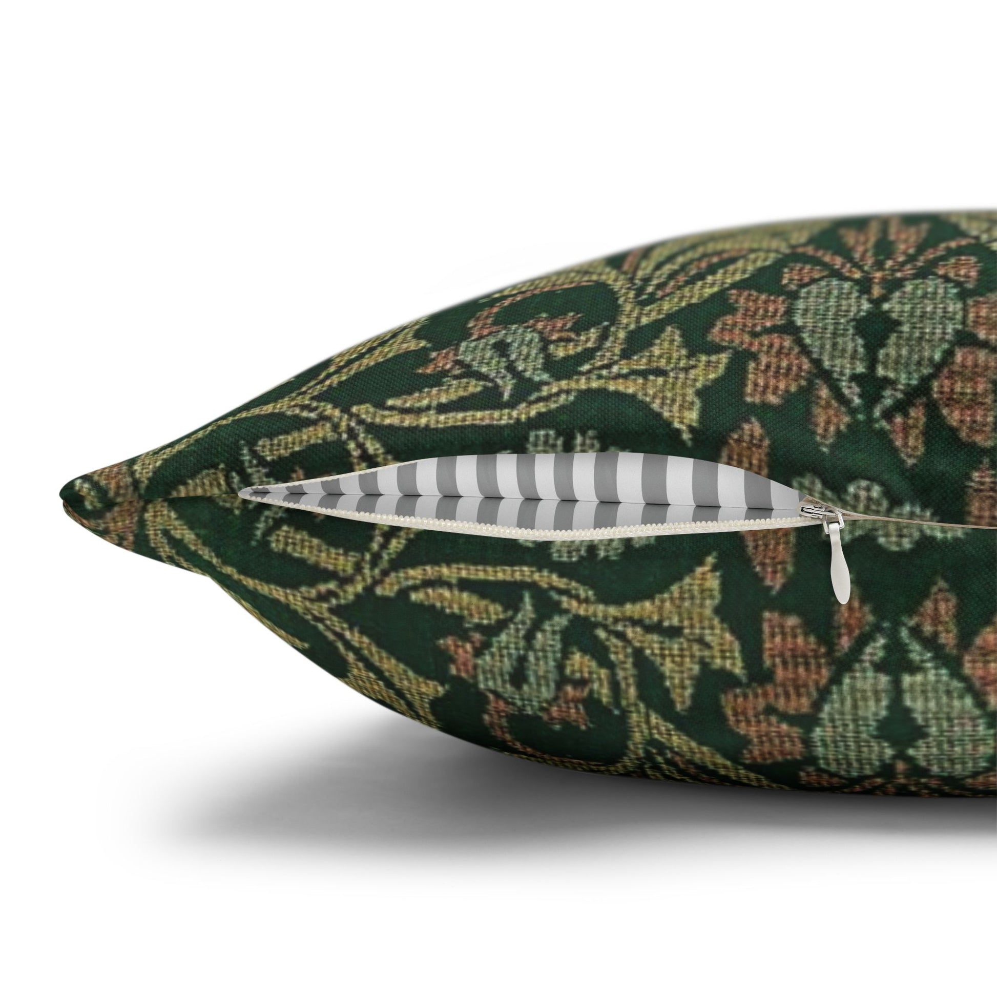 Decorative pillow with a green floral pattern on a white background