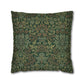 Decorative pillow with intricate green and brown floral pattern on a white background