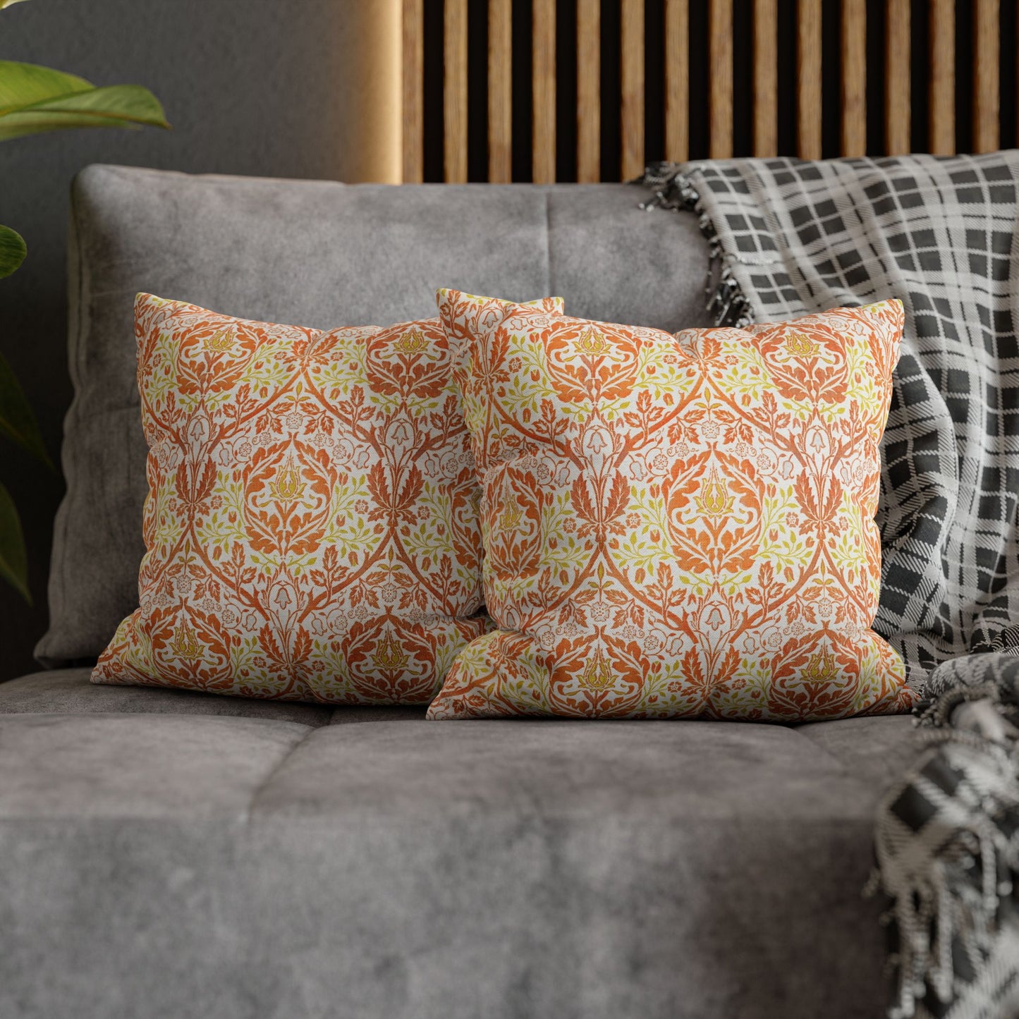 Decorative pillows with a floral pattern on a gray sofa - William Morris Golden Bough