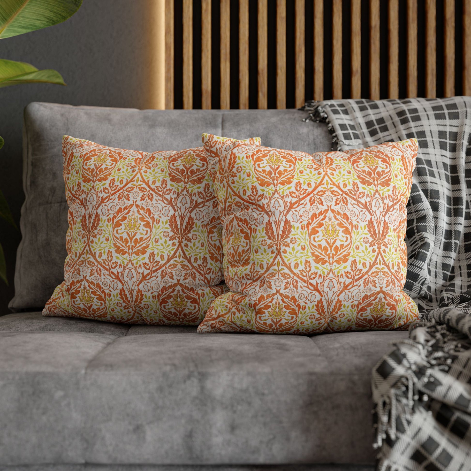 Decorative pillows with a floral pattern on a gray sofa - William Morris Golden Bough