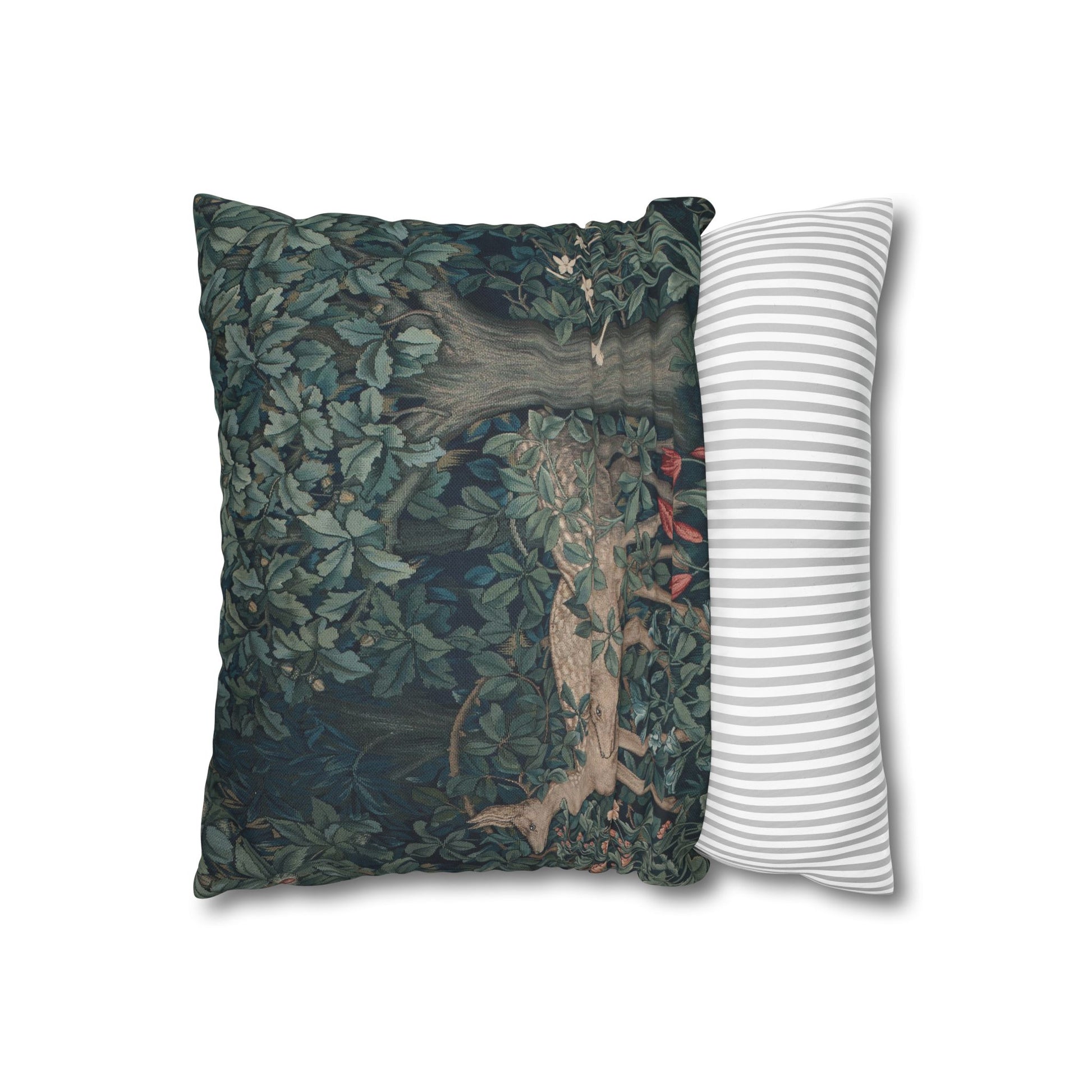 Decorative pillow with nature-themed design next to a striped pillow on a white background