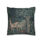 Decorative pillow with a deer and nature design on a white background
