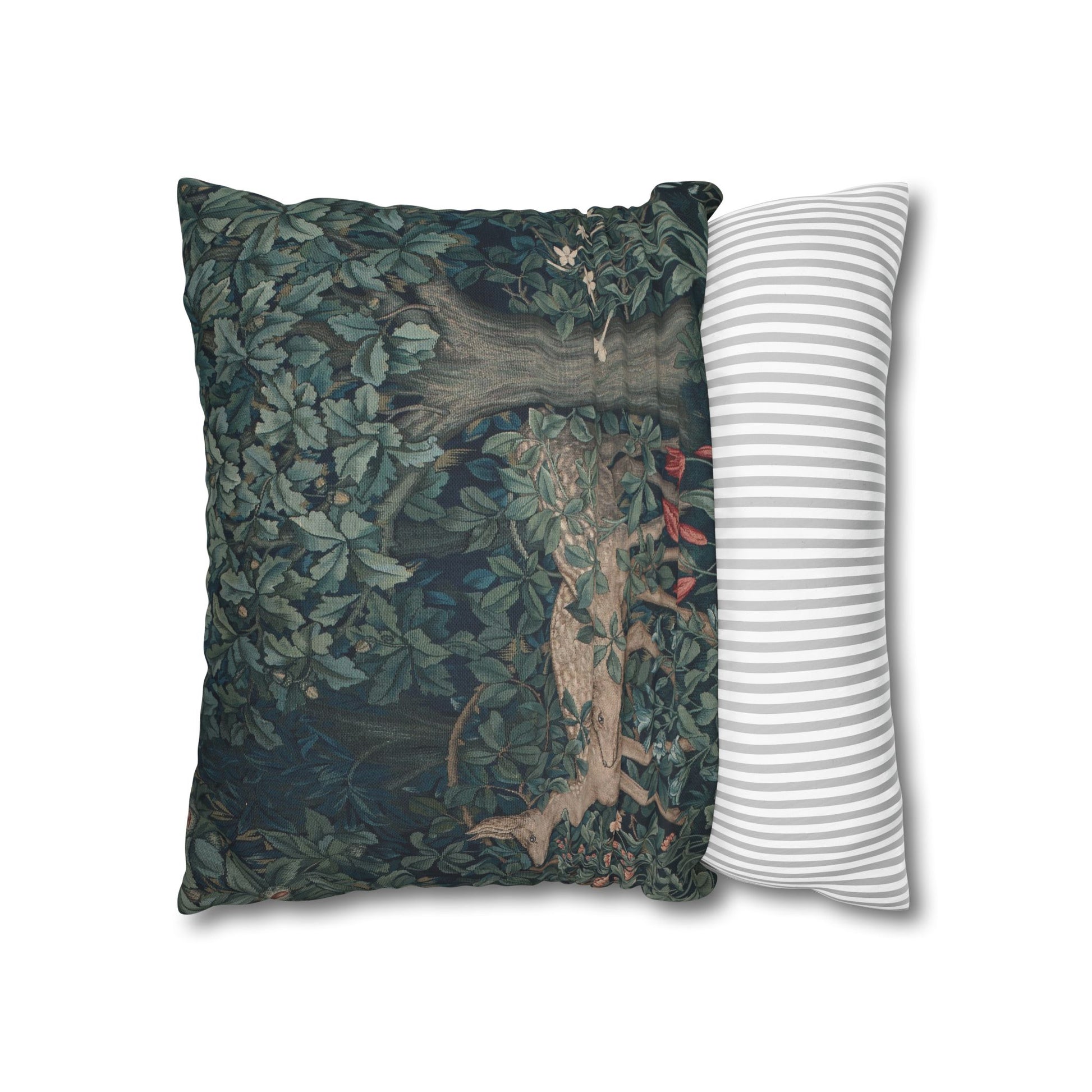 Decorative pillow with nature-themed design next to a striped pillow on a white background
