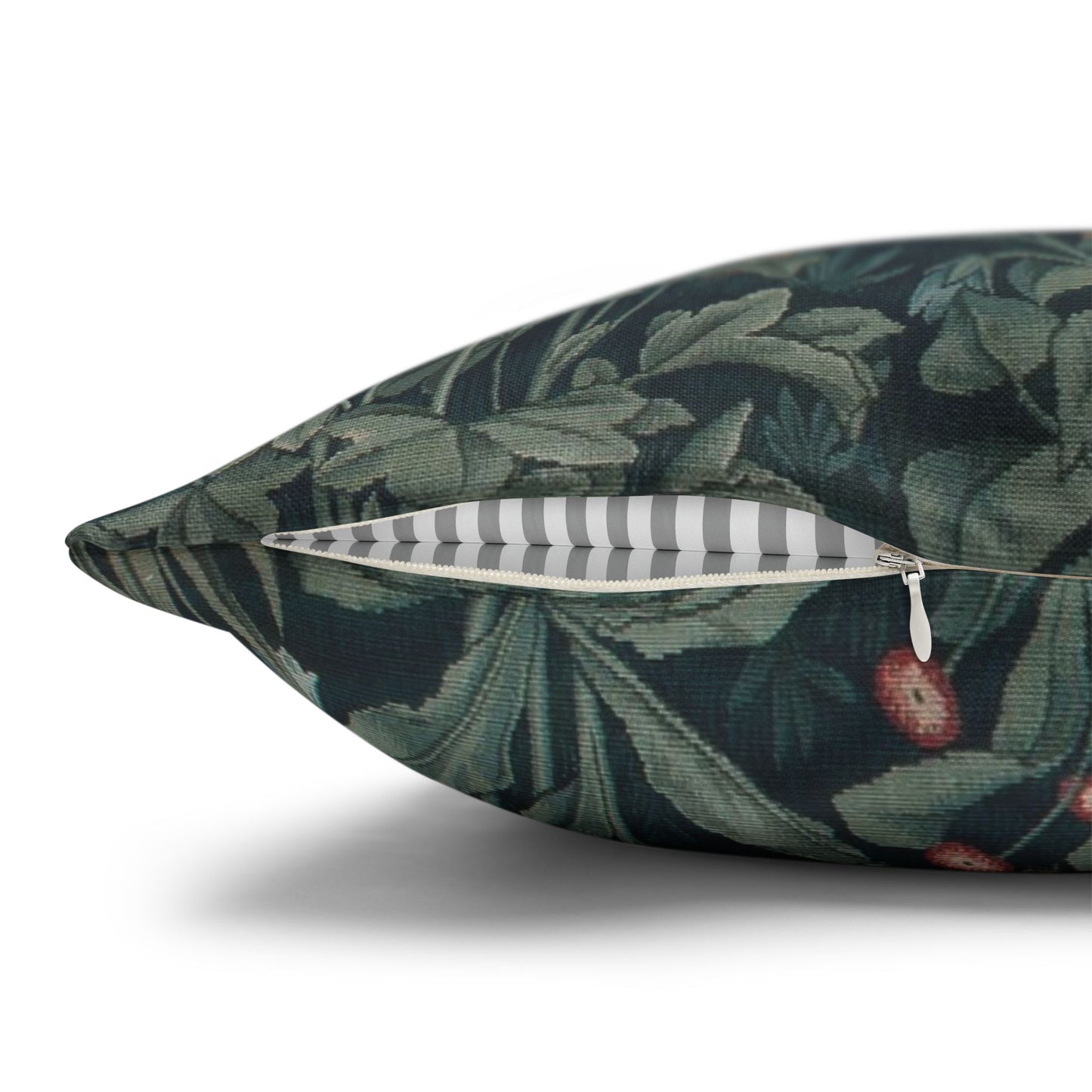 Decorative pillow with green leaf pattern on a white background