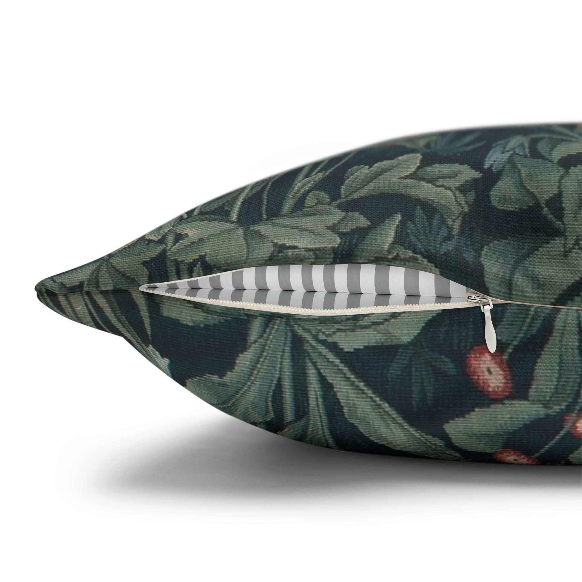 Decorative pillow with green leaf pattern on a white background