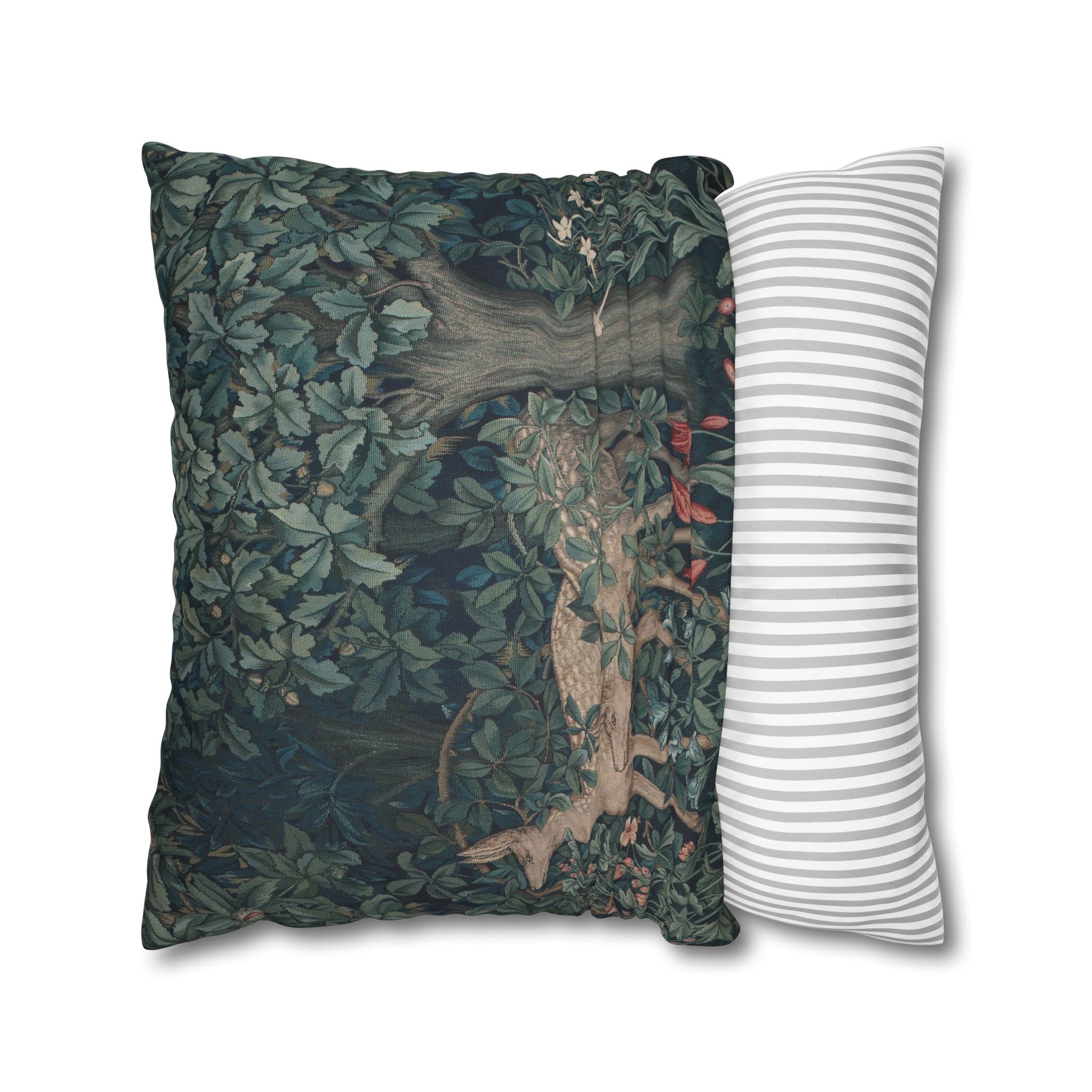 Decorative pillow with nature-themed design and a striped pillow next to it on a white background