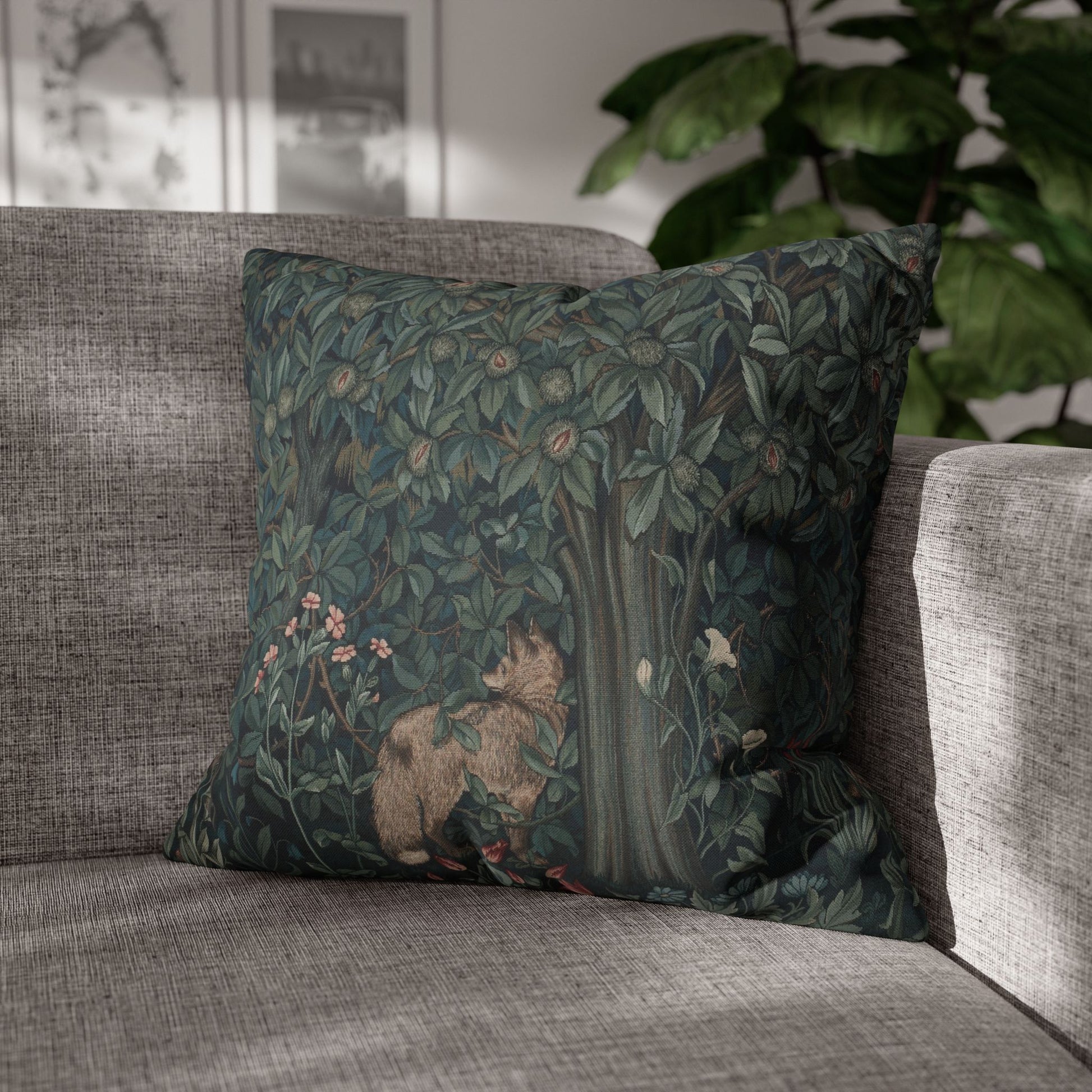Decorative pillow with nature-themed design on a gray sofa - William Morris Greenery
