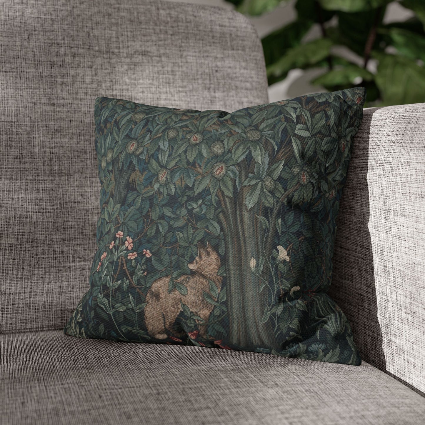 Decorative pillow with nature-themed design on a gray sofa - William Morris Greenery