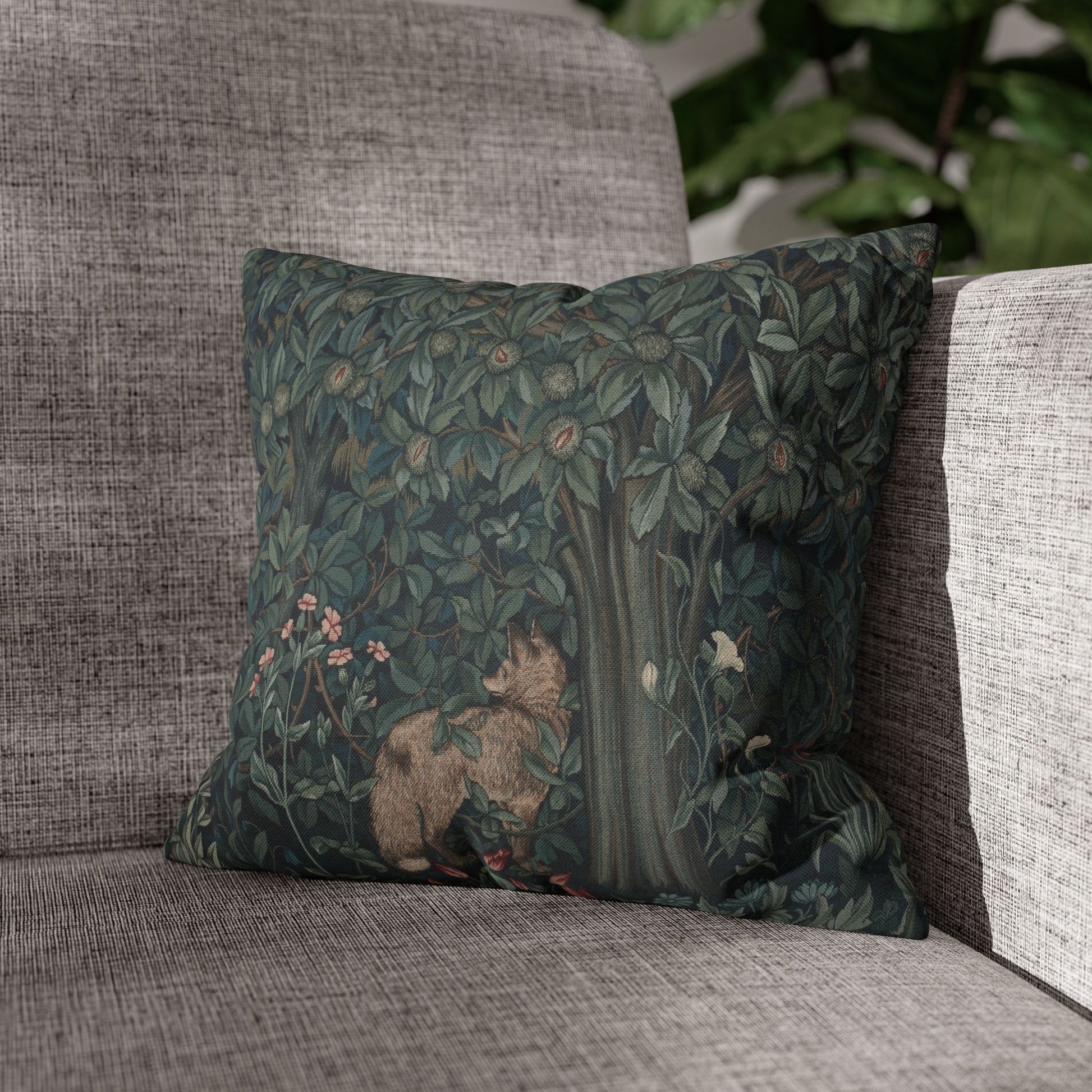 Decorative pillow with nature-themed design on a gray sofa - William Morris Greenery