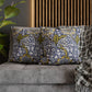 Decorative pillows with floral pattern on a gray sofa