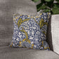Decorative pillow with floral pattern on a gray sofa