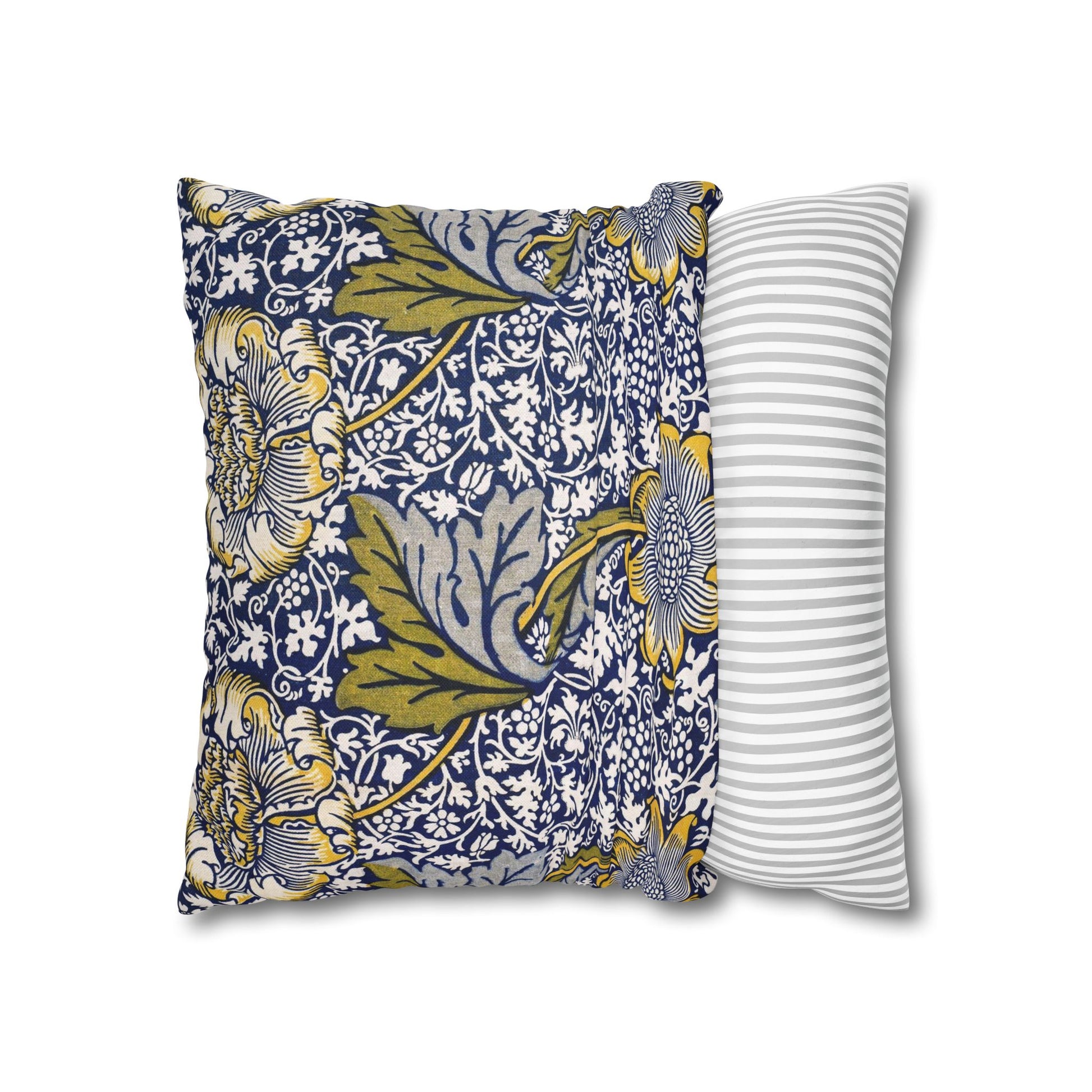 Two pillows, one with floral pattern and one with stripes, on a white background