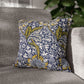 Decorative pillow with floral pattern on a gray sofa