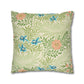 Decorative pillow with floral and leaf pattern on a white background