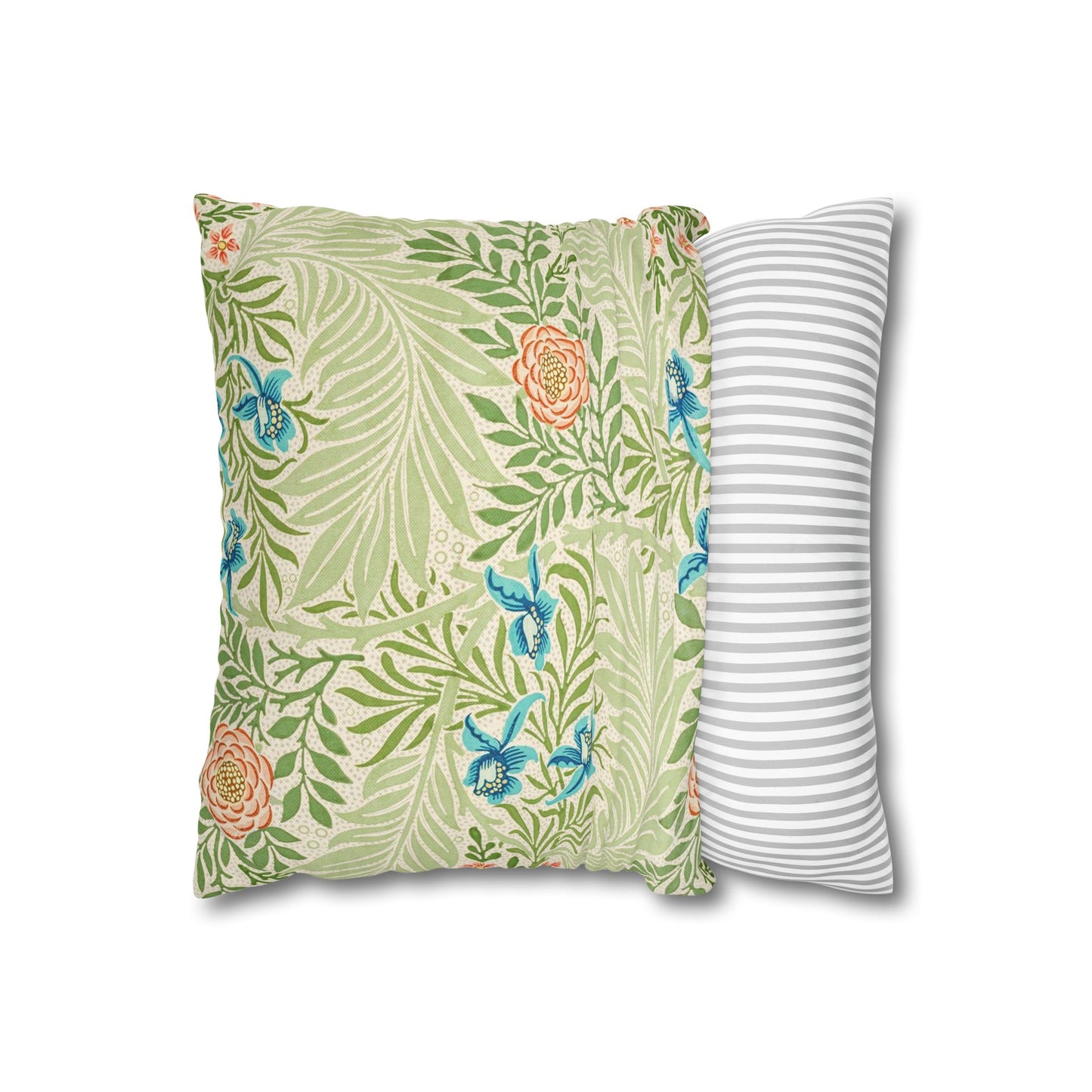 Floral and striped decorative pillows on a white background