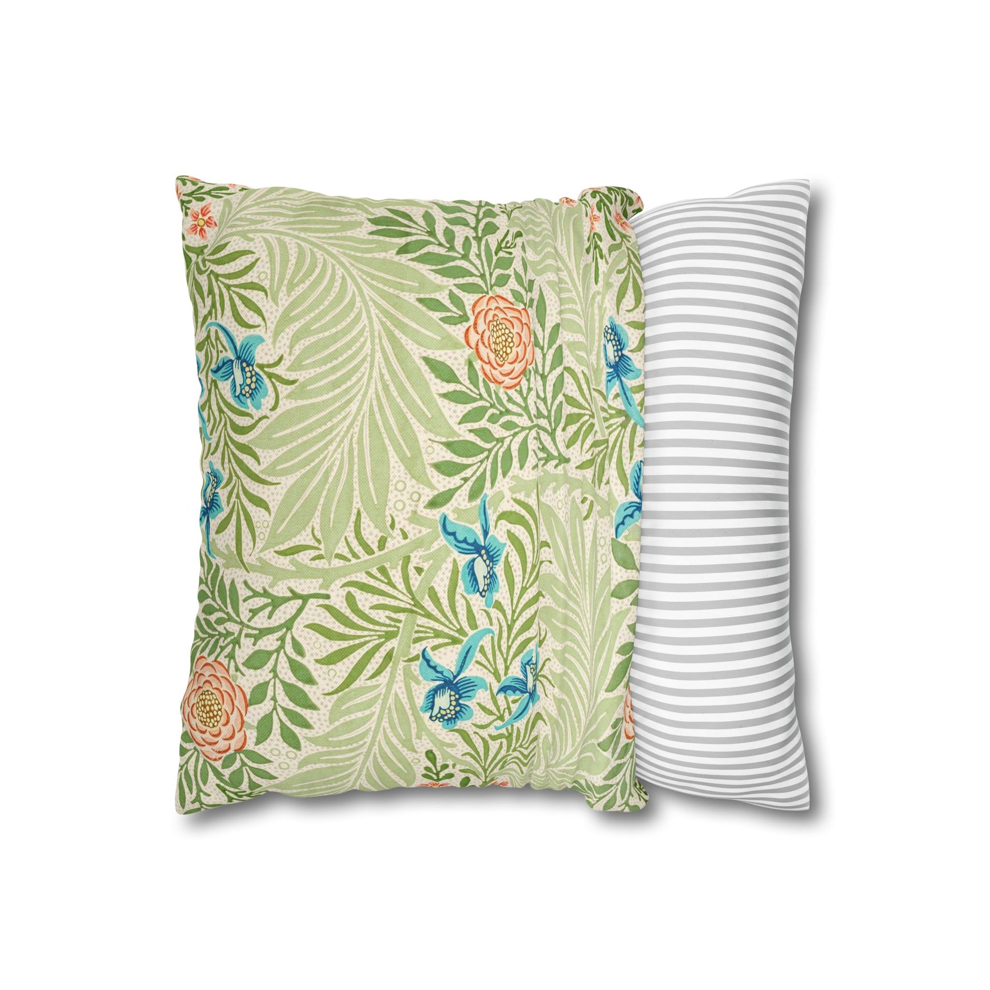 Floral and striped decorative pillows on a white background