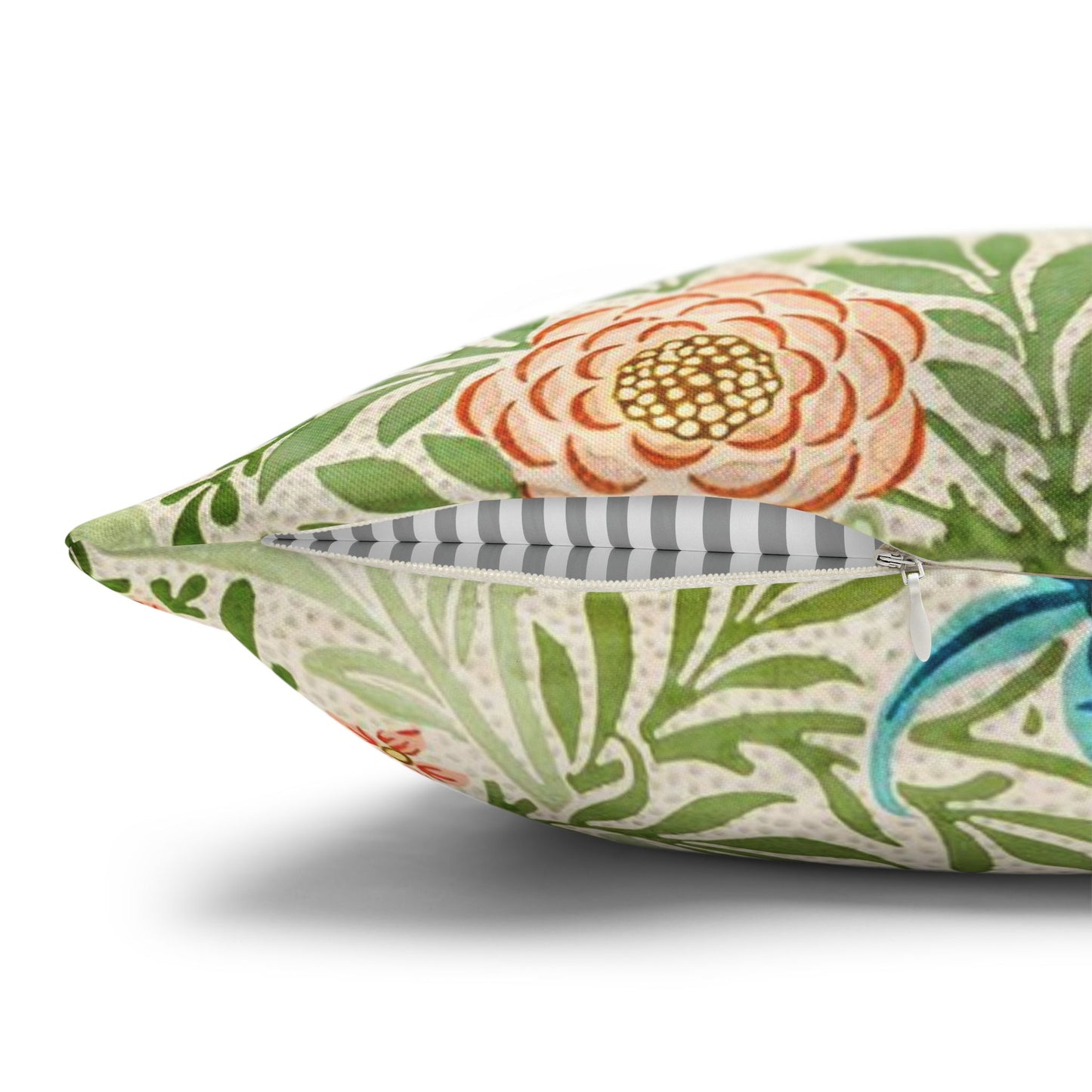 Floral patterned pillow with a zipper on a white background