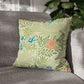 Decorative pillow with floral pattern on a gray sofa