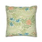 Decorative pillow with floral and leaf pattern on a white background