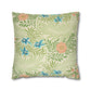 Decorative pillow with floral and leaf pattern on a white background
