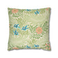Floral and leaf patterned pillow on a white background