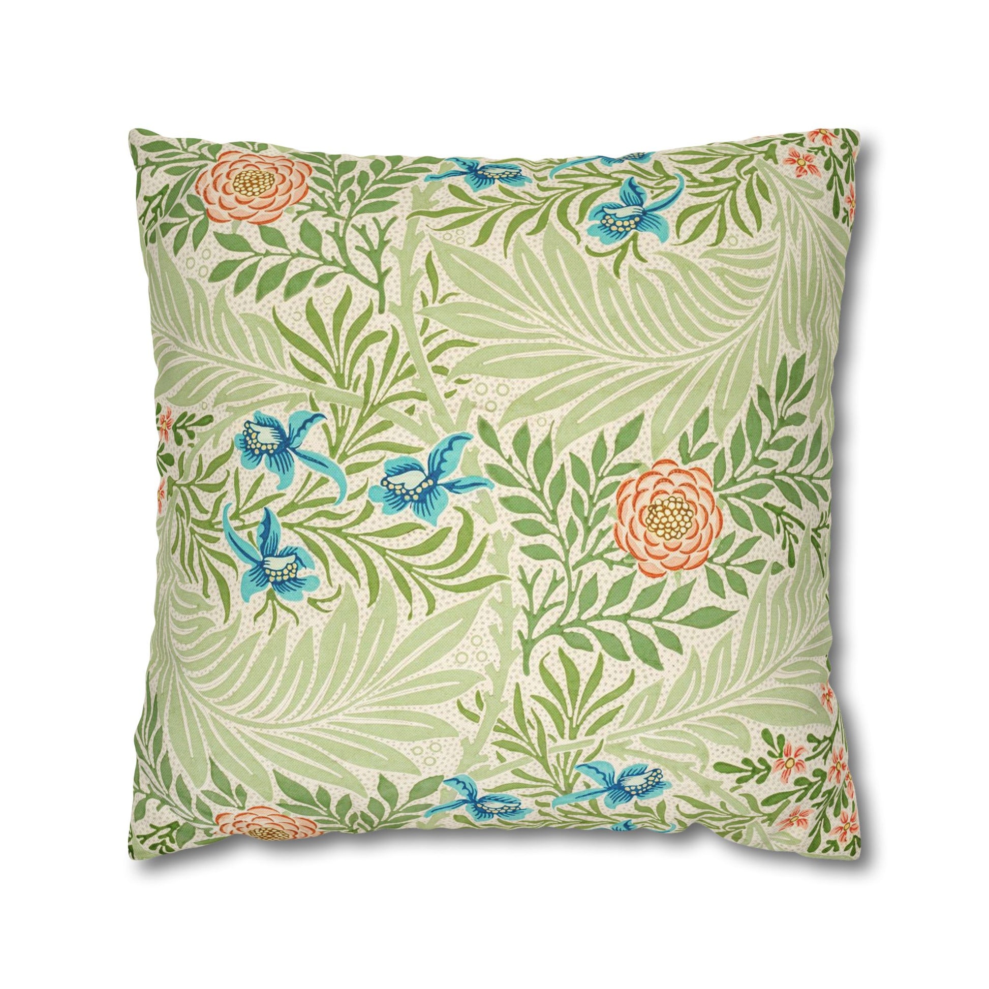 Floral and leaf patterned pillow on a white background