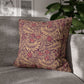 Decorative pillow with a leaf pattern on a gray sofa