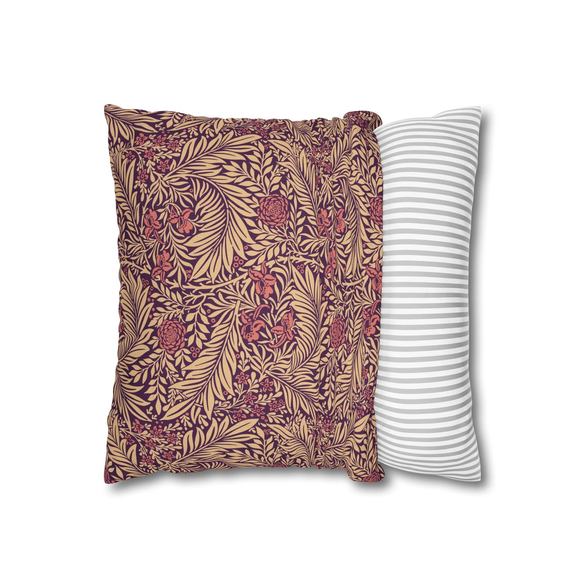 Two pillows, one with a floral pattern and the other with a striped pattern, on a white background.